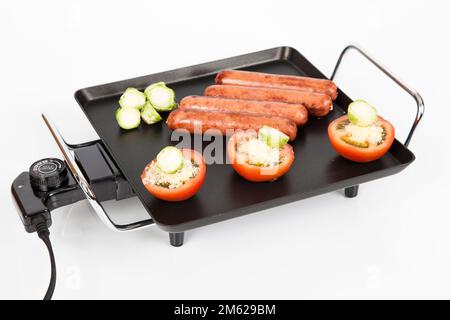 Electric griddle for cooking; photo on white background. Stock Photo