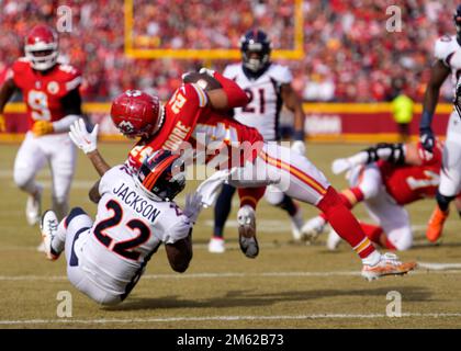 Jacksonville, FL, USA. 19th Sep, 2021. Jacksonville Jaguars running back  James Robinson (25) is pursued by Denver Broncos safety Kareem Jackson (22)  during 2nd half NFL football game between the DenverBroncos and