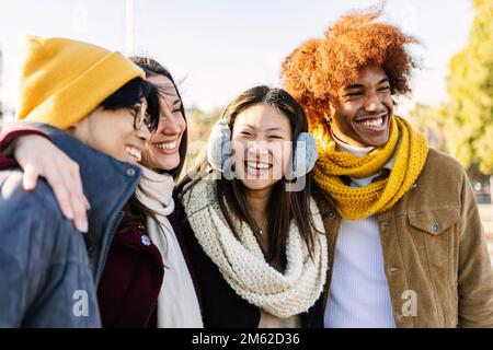 Group of four multiracial young friends enjoying time together having fun Stock Photo