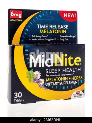 Winneconne, WI - 28 November 2022: A package of Midnite  sleep aid supplement with melatonin on an isolated background. Stock Photo