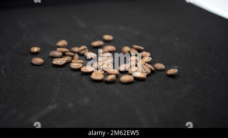 coffee beans in a cup on a black background. Filter coffee, Turkish and Arabic coffees Stock Photo