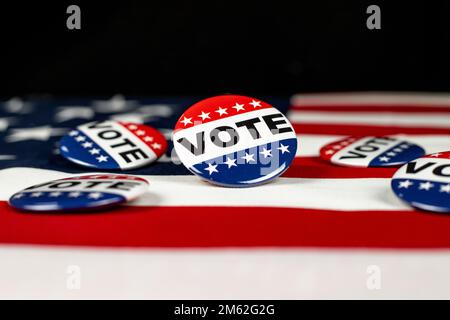 Vote buttons on an American flag with negative space. Stock Photo