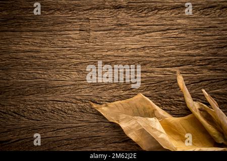 Autumn Leaves over wooden texture background. space. Stock Photo