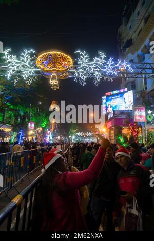 Kolkata, West Bengal, India - 26.12.2018 : Christmas celebration by enthusiastic young public at illuminated and decorated park street with lights. Stock Photo