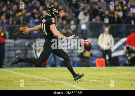 Baltimore Ravens punter Jordan Stout (11) runs off the field at halftime of  an NFL football game against the New England Patriots, Sunday, Sep. 25,  2022, in Foxborough, Mass. (AP Photo/Stew Milne