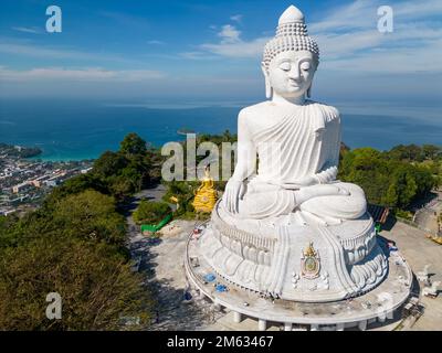 Big Buddha is a seated Maravija Buddha statue in Phuket, Thailand. The official name is Phra Phutta Ming Mongkol Eknakiri shortened to Ming Mongkol Bu Stock Photo