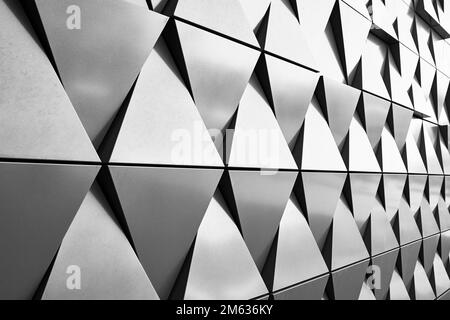 Silver wall facade with geometric shapes triangle elements. Abstract architecture details pattern. Minimal abstract background Stock Photo