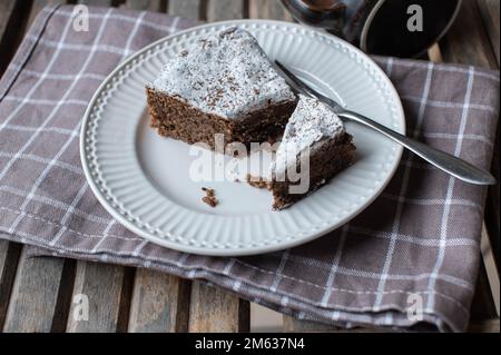 Piece of chocolate cake on a white plate Stock Photo
