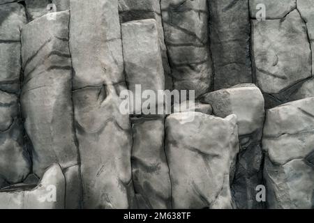 Basalt volcanic rock formations in Reinisfjara beach near Vik in northern Iceland as background Stock Photo