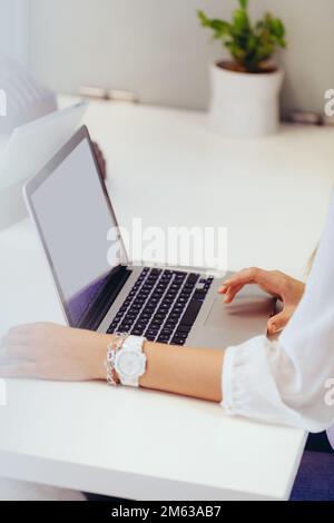 Anonymous woman typing on Her Laptop Stock Photo