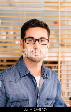 Portrait young entrepreneur at the office looking at camera Stock Photo