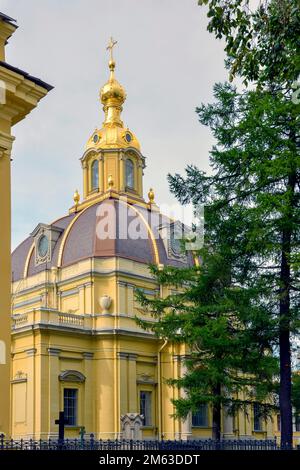 Orthodox Christian church with golden cupolas inside the gardens of Saint Peter's fortress in Saint Petersburg.