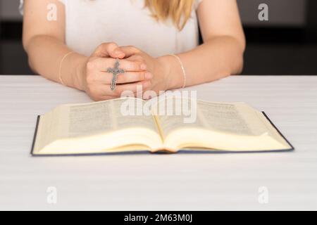 Silhouette of woman praying with cross in nature sunrise background ...
