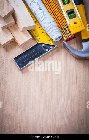 Variation of working building tools on wooden board vertical version construction concept. Stock Photo