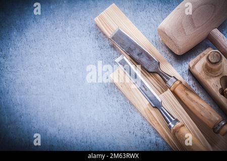 Wooden shaving plane hammer stud flat chisels construction concept. Stock Photo