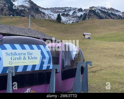 Schetteregg, Austria. 02nd Jan, 2023. Completely green and without snow is a slope at a lift in the ski resort Schetteregg. It is currently much too warm here for the time of year. Credit: Benedikt von Imhoff/dpa/Alamy Live News Stock Photo