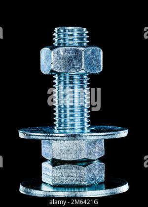 Construction nut screwbolt bolt washer on black background. Stock Photo