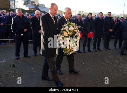 Celtic chief executive Peter Lawell (right) and Celtic Director Michael Nicholson lay a wreath in memory of those that died at in the Ibrox disaster, 52 years ago today, ahead of the cinch Premiership match at Ibrox Stadium, Glasgow. Picture date: Monday January 2, 2023. Stock Photo