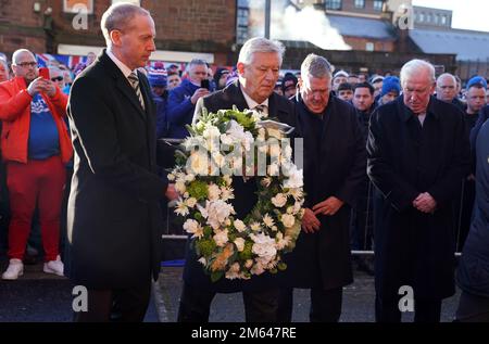 Celtic chief executive Peter Lawell (right) and Celtic Director Michael Nicholson lay a wreath in memory of those that died at in the Ibrox disaster, 52 years ago today, ahead of the cinch Premiership match at Ibrox Stadium, Glasgow. Picture date: Monday January 2, 2023. Stock Photo