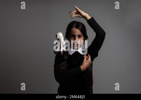 a girl Wednesday Addams. Halloween party Stock Photo