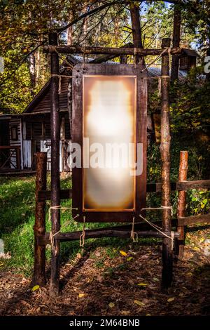 Wooden signs-pointers in a deep dark forest. Stock Photo