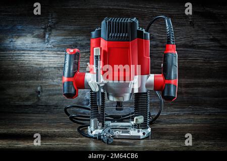 red speed variable power small plunge router milling machine portable electric hand mini wood router on vintage wood Stock Photo