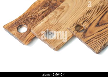 very close up view three oak wood serving boards isolated on white Stock Photo