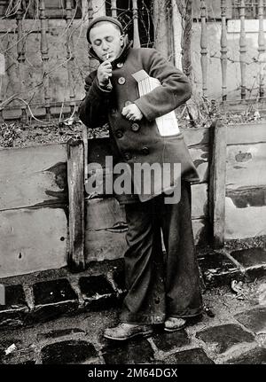 Having a smoke. American soldier who has found good tobacco in his American Red Cross Christmas box 1917, France Stock Photo