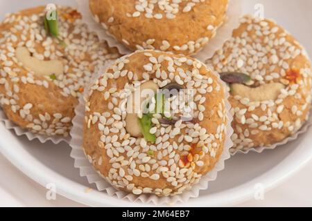 Winter Season Special Traditional Punjabi Mithai Til Tikki Or Tilkut Gud Mawa Bati Is Made Of Dry Roasted Sesame Seeds With Mava, Khoya, Jaggery, Gur, Stock Photo