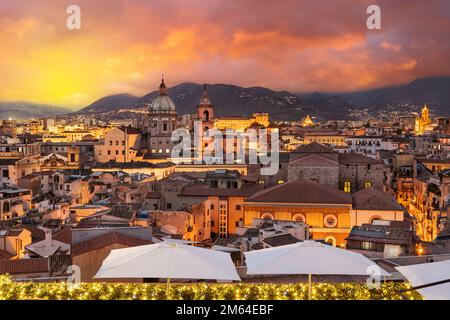 Palermo, Sicily town skyline with landmark towers at dusk.