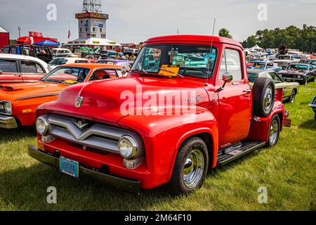 Iola, WI - July 07, 2022: High perspective front corner view of a 1955 Ford F-100 Pickup Truck at a local car show. Stock Photo