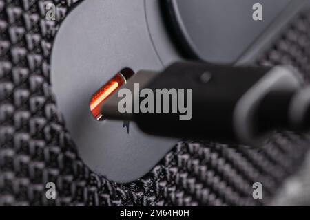 Closeup of USB Type C connector and black cable being connected. Stock Photo