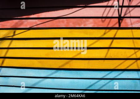Georgetown, Penang, Malaysia - November 2012: Colorful painted wooden boards on the wall of a house in the ancient traditional Clan jetties in George Stock Photo