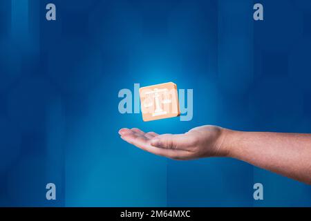 Woman hand showing balance justice icon with modern blue background. Legal advice technology service concept. Law and defense. Stock Photo