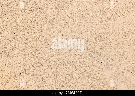 The little sand pellets built by Sand bubbler crabs on Small Sandy Beach in Khao Lak, Thailand Stock Photo