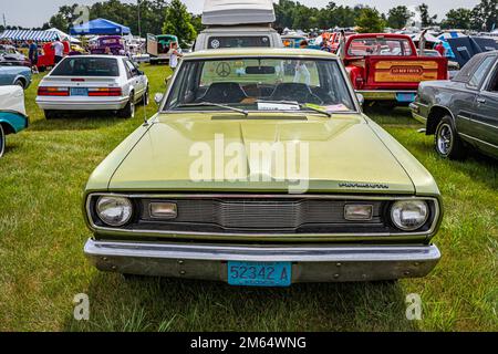 Iola, WI - July 07, 2022: High perspective front view of a 1971 Plymouth Valiant Sedan at a local car show. Stock Photo