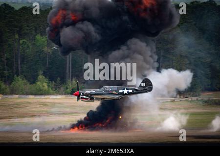 Thom Richard, an air demonstration pilot flying the P-40, performs an aerial demonstration during the Shaw Air & Space Expo at Shaw Air Force Base, South Carolina, April 2, 2022. Participation in air shows allow the 20FW to showcase their capabilities to the public, while simultaneously building community relations. Stock Photo