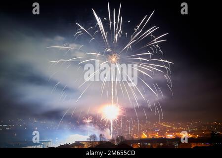 New Year's Eve fireworks over the city Hunedoara, Romania Stock Photo