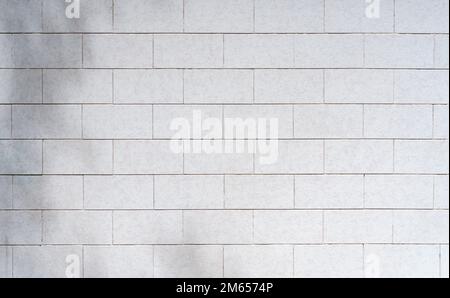 White tile background. Wall with white tiles for the interior of the kitchen or bathroom in the house. Decor, design and decoration of kitchen and bathroom interiors. High quality photo Stock Photo