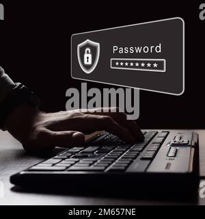Man's hands on keyboard in darkness. Hacking password. Selective focus. Stock Photo
