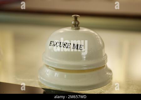 Hand ringing in service bell  Stock Photo