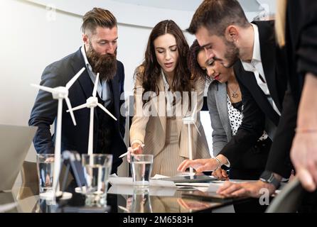 Multiethnic and multicultural business people working together on sustainable innovation project - Green renewable energy concept Stock Photo