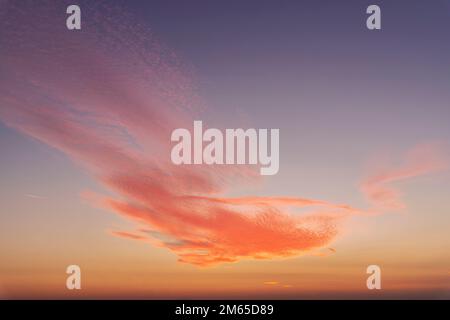 Dramatic colorful red orange to dark blue sunset or sunrise sky landscape clouds. Natural beautiful cloudscape dawn background wallpaper. Stormy windy Stock Photo