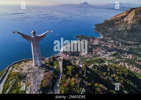 Aerial view of the statue of the Redeemer or Christ the Redeemer overlooking the Lucanian city of Maratea.Potenza province, Basilicata, Italy Stock Photo