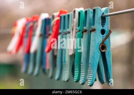 Clothespins and Clothes line on blur background, Stock Photo