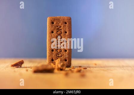 Bourbon Creams - A traditional chocolate biscuit displayed on a blue background.Sweet food often eaten with a cup of tea. Stock Photo