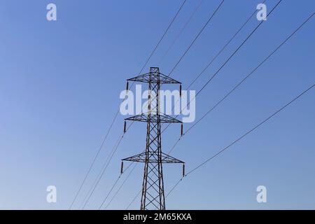 Electrical Pylon.Also known as transmission towers.UK National Grid.On a clear blue sky. Stock Photo