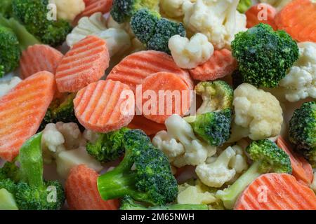 Mix of frozen vegetables background close up Stock Photo