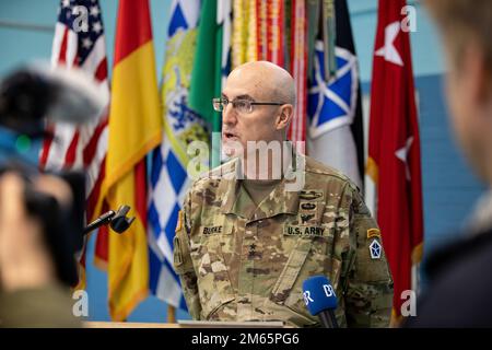 ANSBACH, Germany - Maj. Gen. Robert Burke, deputy commanding general of support, V Corps, addresses the press during a press conference in Ansbach after a welcome ceremony at Barton Barracks in Ansbach, Germany, Tuesday, April 5. During the ceremony, the V Corps headquarters and the headquarters and headquarters battalion uncased their colors at their temporary home. The presence of the entire Victory Corps headquarters in Europe expands U.S. Army Europe and Africa’s ability to command land forces in Europe and sends a strong message to our NATO allies and partners that the United States is co Stock Photo