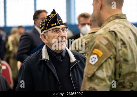 ANSBACH, Germany - Mr. Ken Aungst, commander, American Legion Ansbach Post 1982, meets with U.S. Army V Corps leaders during a welcome ceremony at Barton Barracks in Ansbach, Germany, Tuesday, April 5. During the ceremony, the V Corps headquarters and the headquarters and headquarters battalion uncased their colors at their temporary home. The presence of the entire Victory Corps headquarters in Europe expands U.S. Army Europe and Africa’s ability to command land forces in Europe and sends a strong message to our NATO allies and partners that the United States is committed to European security Stock Photo